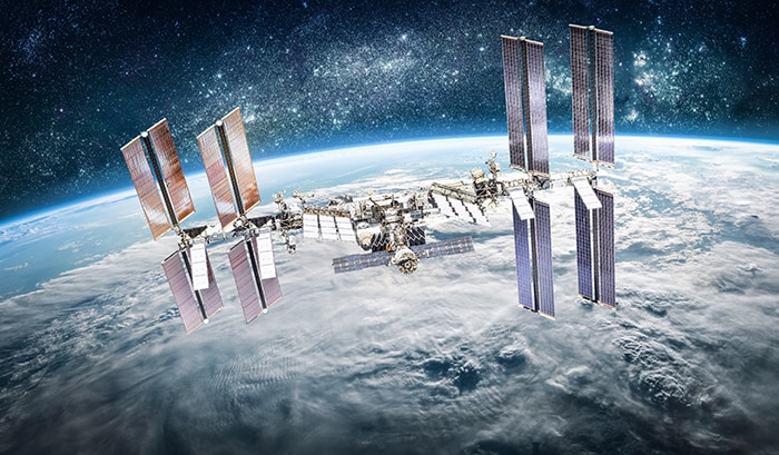 International space station on orbit of Earth planet. ISS. Stars and galaxies. Elements of this image furnished by NASA